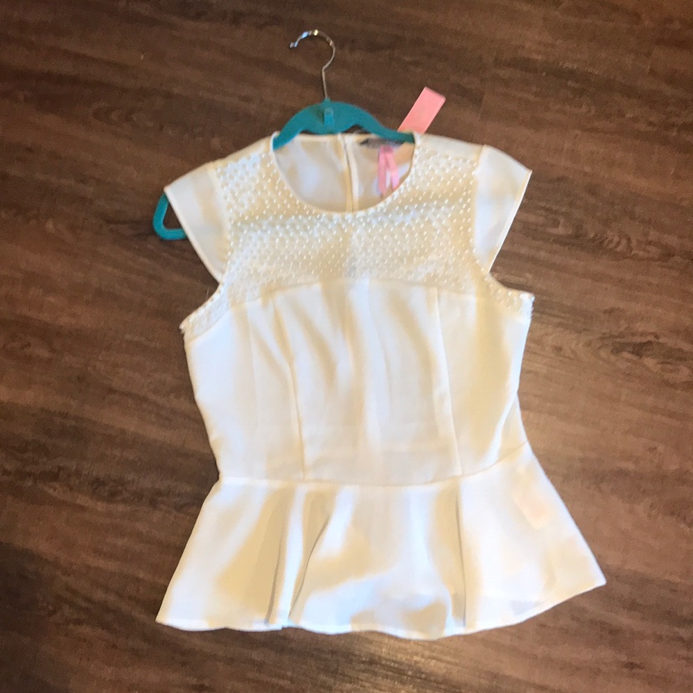Short sleeve, peplum top in cream